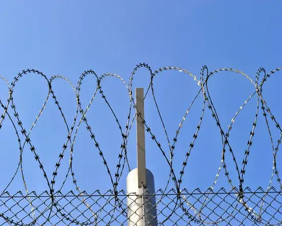 Flat-profile razor wire for perimeter protection.